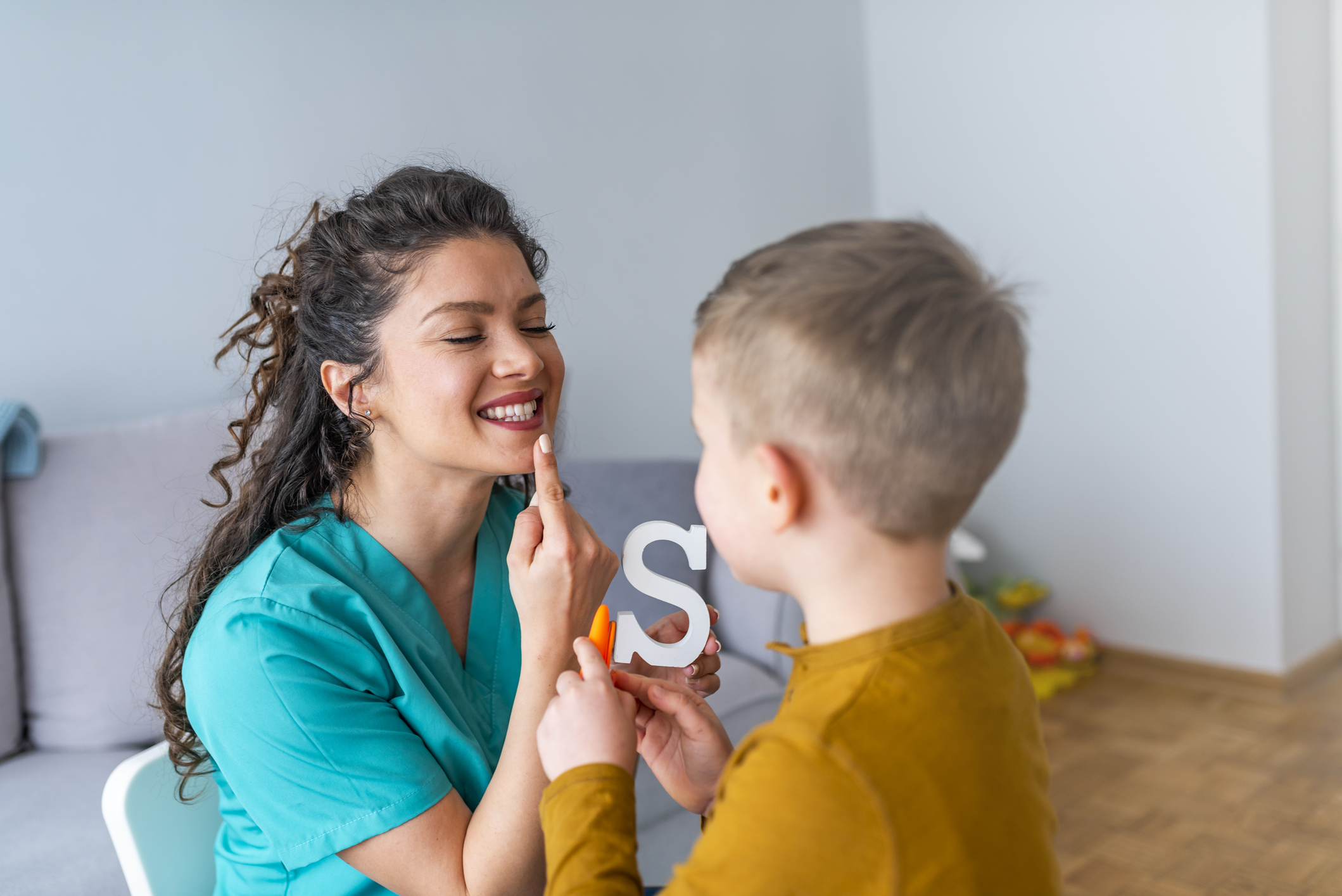 Shot Of A Speech Therapist During A Session With A Little Boy