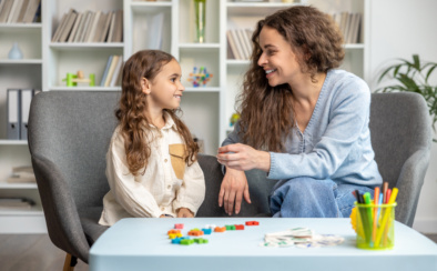 Cute Long Haired Girl Having Speech Therapy Session With The Doctor